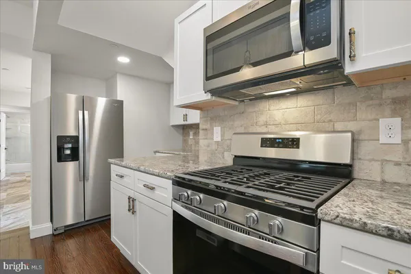 a view of a bathroom with a shower and a sink