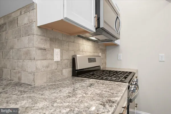 a building outdoor space with patio furniture and potted plants