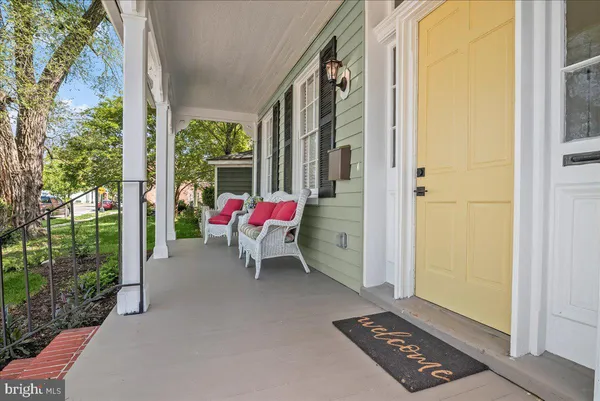 a kitchen with a white stove top oven and white cabinets