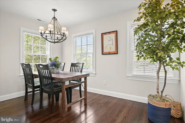 a kitchen with granite countertop a sink a stove and cabinets