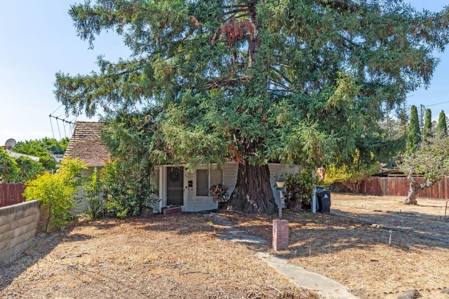 89 Centre Street Mountain View, CA 94041 - Photo 1 of 32 a front view of a house with a tree