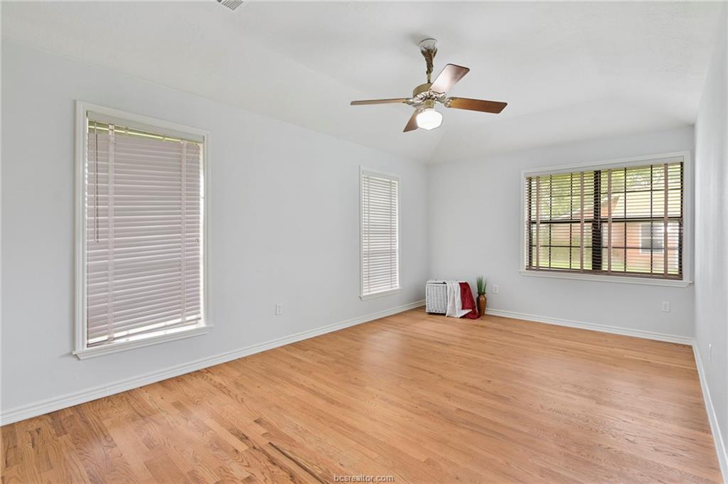 1031 Rose Circle College Station, TX 77840 - Photo 16 of 26 Spare room featuring light wood-type flooring and ceiling fan
