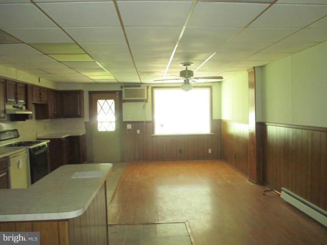 7044 Belclare Road Baltimore, MD 21222 - Photo 3 of 8 a kitchen with refrigerator and window