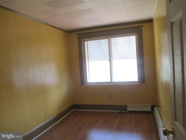 7044 Belclare Road Baltimore, MD 21222 - Photo 7 of 8 an empty room with a window