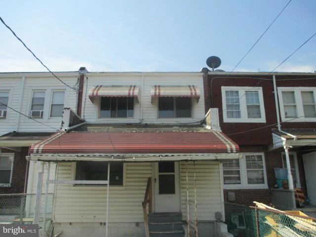 7044 Belclare Road Baltimore, MD 21222 - Photo 8 of 8 a front view of a house with glass windows