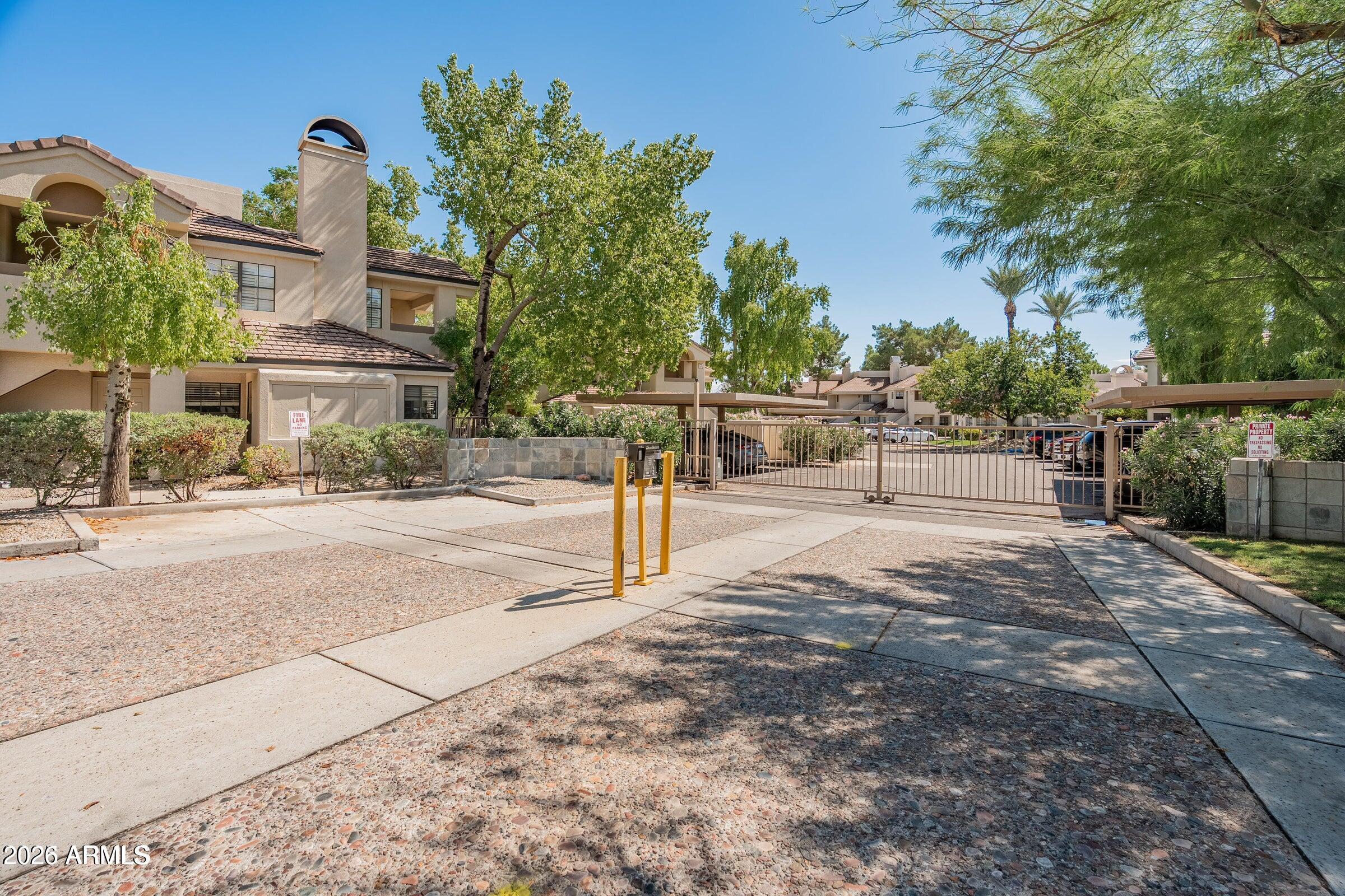 6885 East Cochise Road, Unit 132 Paradise Valley, AZ 85253 - Photo 10 of 10 a view of street with houses