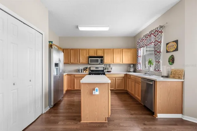 an aerial view of a house with a lake view
