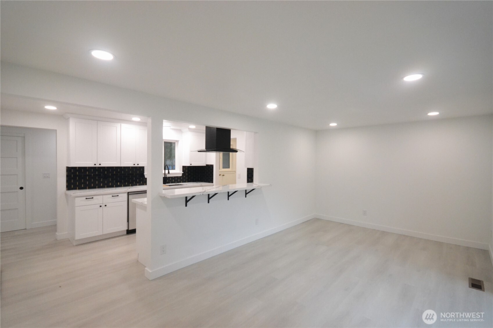 1410 Beech Avenue Steilacoom, WA 98388 - Photo 12 of 38 a large white kitchen with lots of counter space and white cabinets