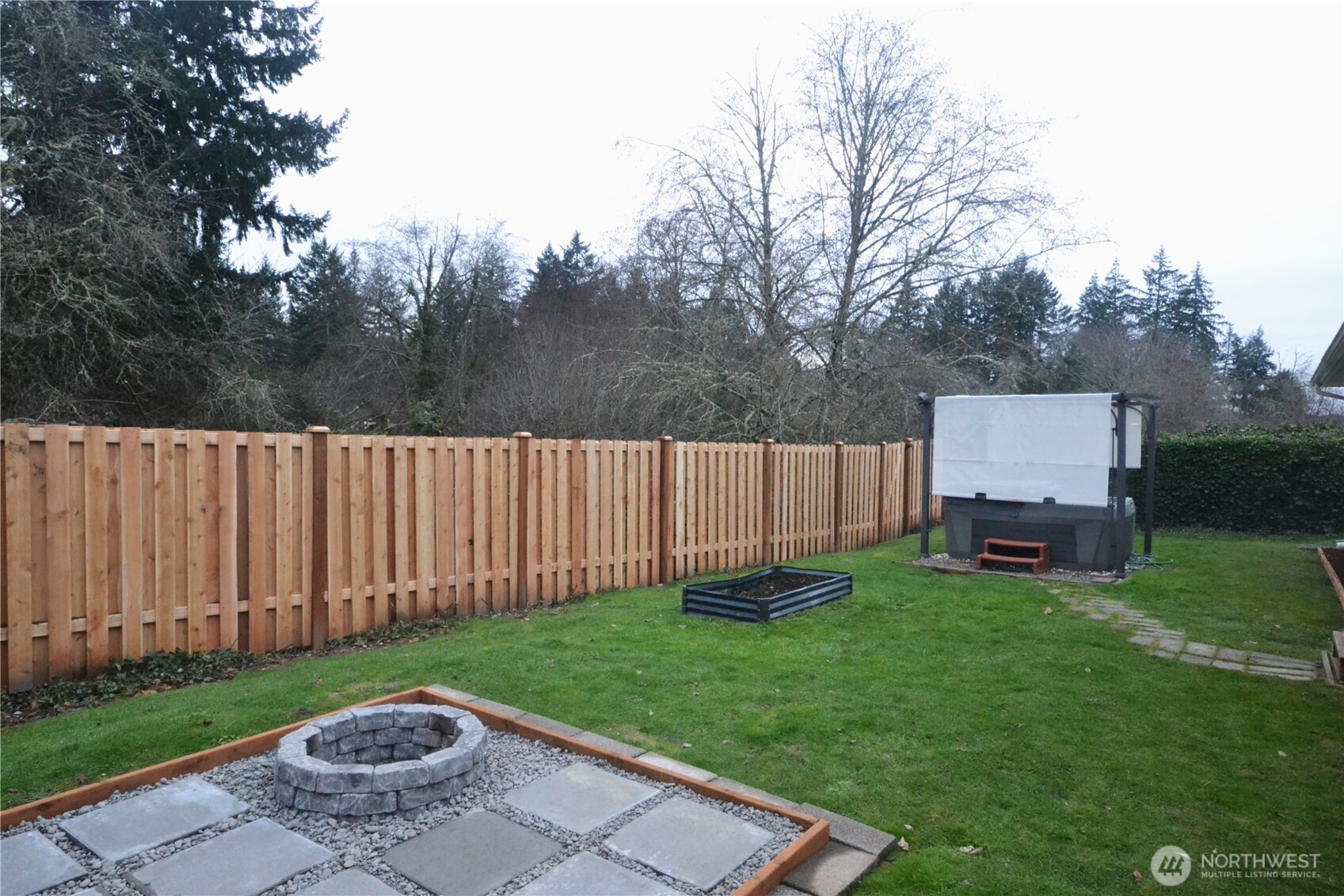 1410 Beech Avenue Steilacoom, WA 98388 - Photo 16 of 38 a view of a backyard with a small cabin
