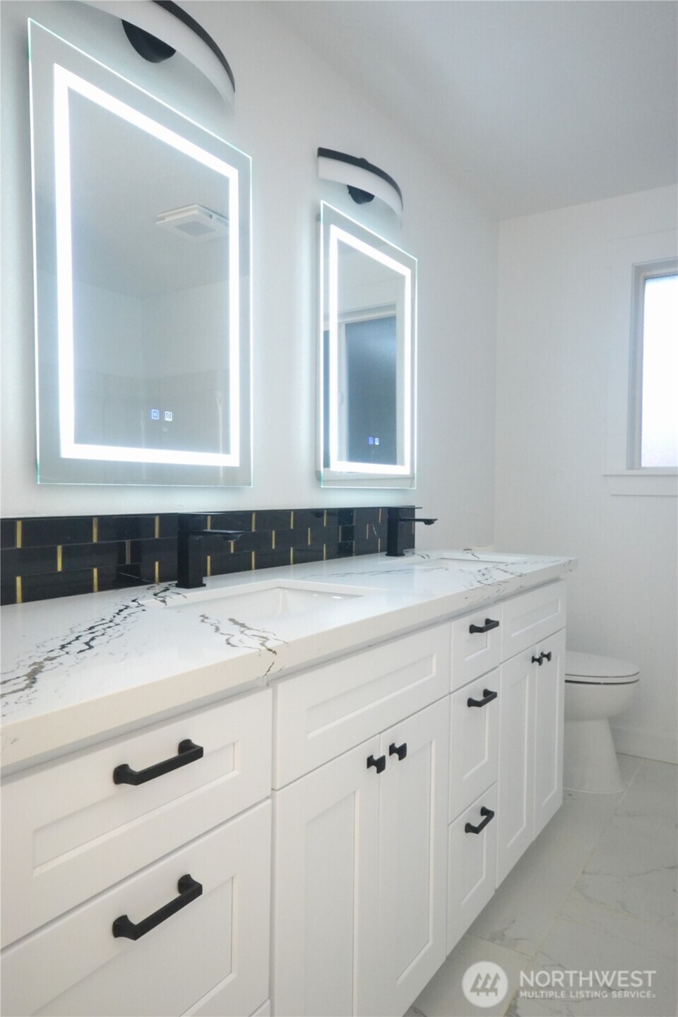 1410 Beech Avenue Steilacoom, WA 98388 - Photo 20 of 38 a bathroom with a sink and a mirror
