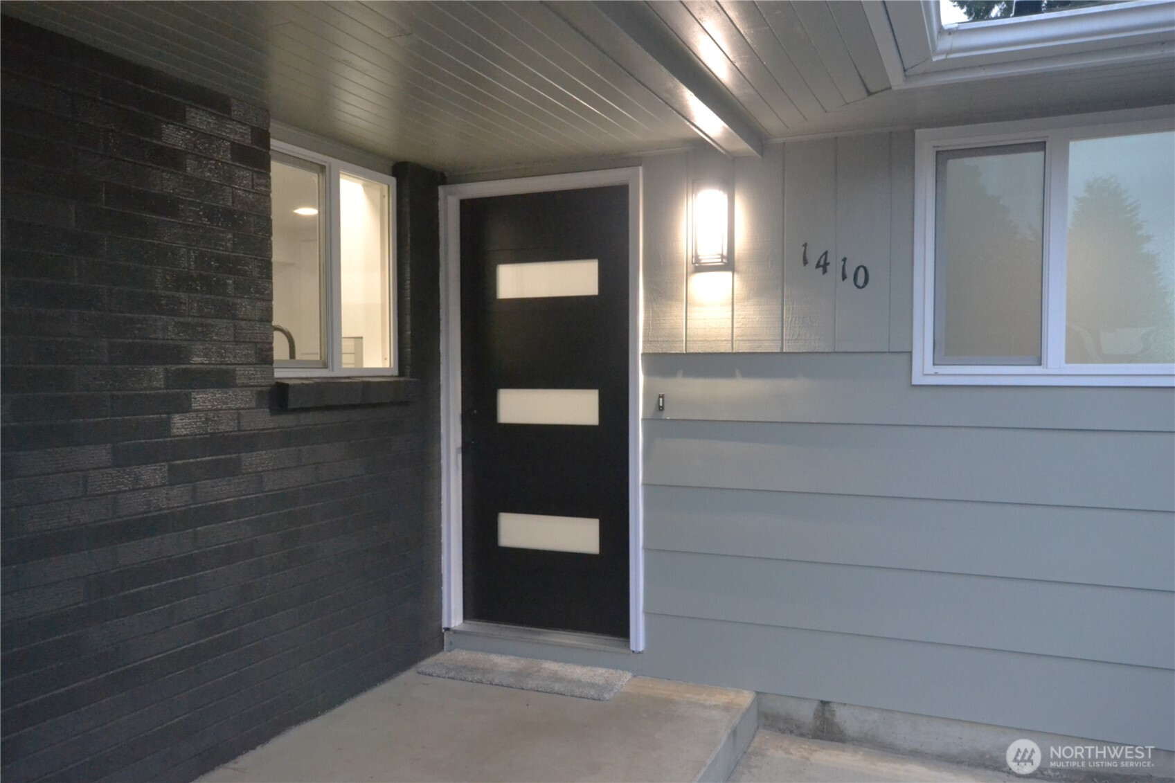 1410 Beech Avenue Steilacoom, WA 98388 - Photo 2 of 38 view of hall way with wooden floor and mirror