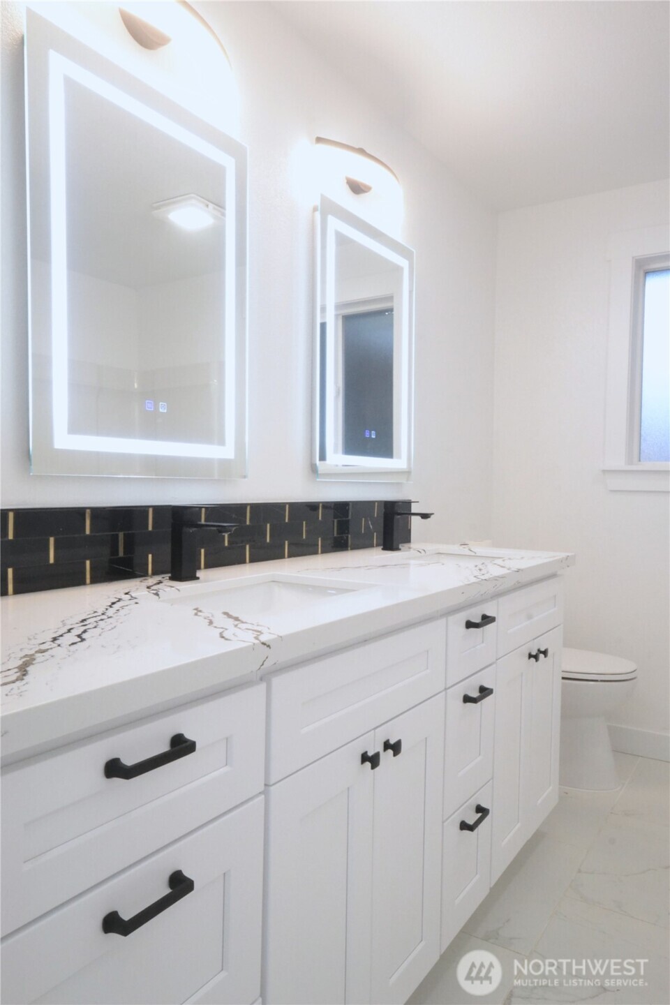 1410 Beech Avenue Steilacoom, WA 98388 - Photo 22 of 38 a bathroom with a sink and a mirror