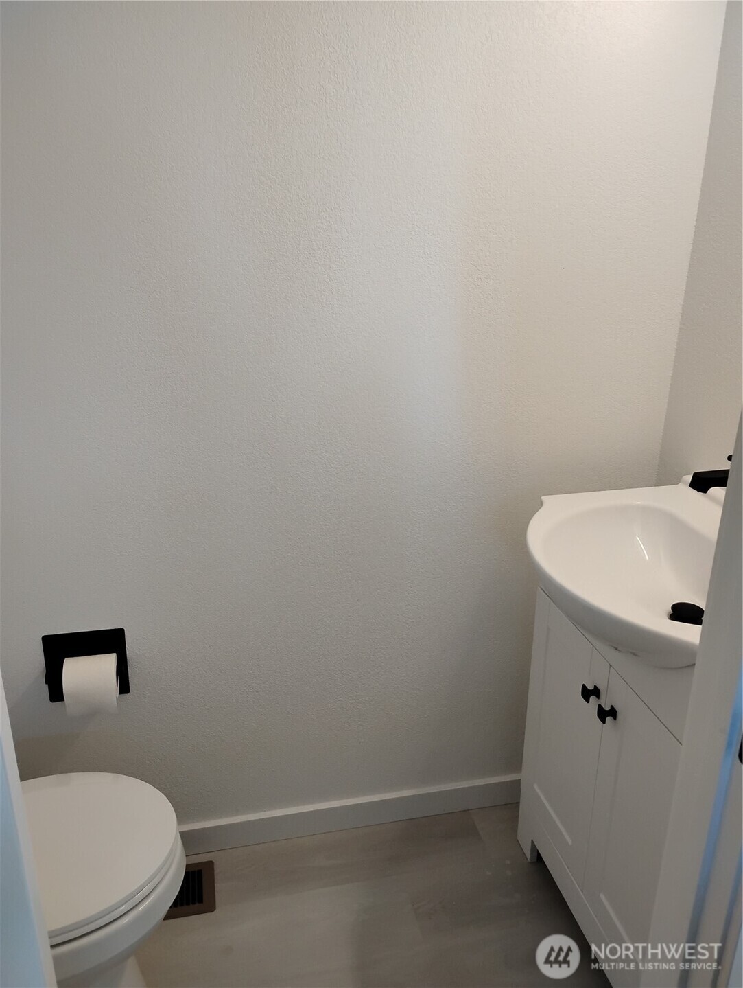1410 Beech Avenue Steilacoom, WA 98388 - Photo 23 of 38 a bathroom with a sink and a toilet