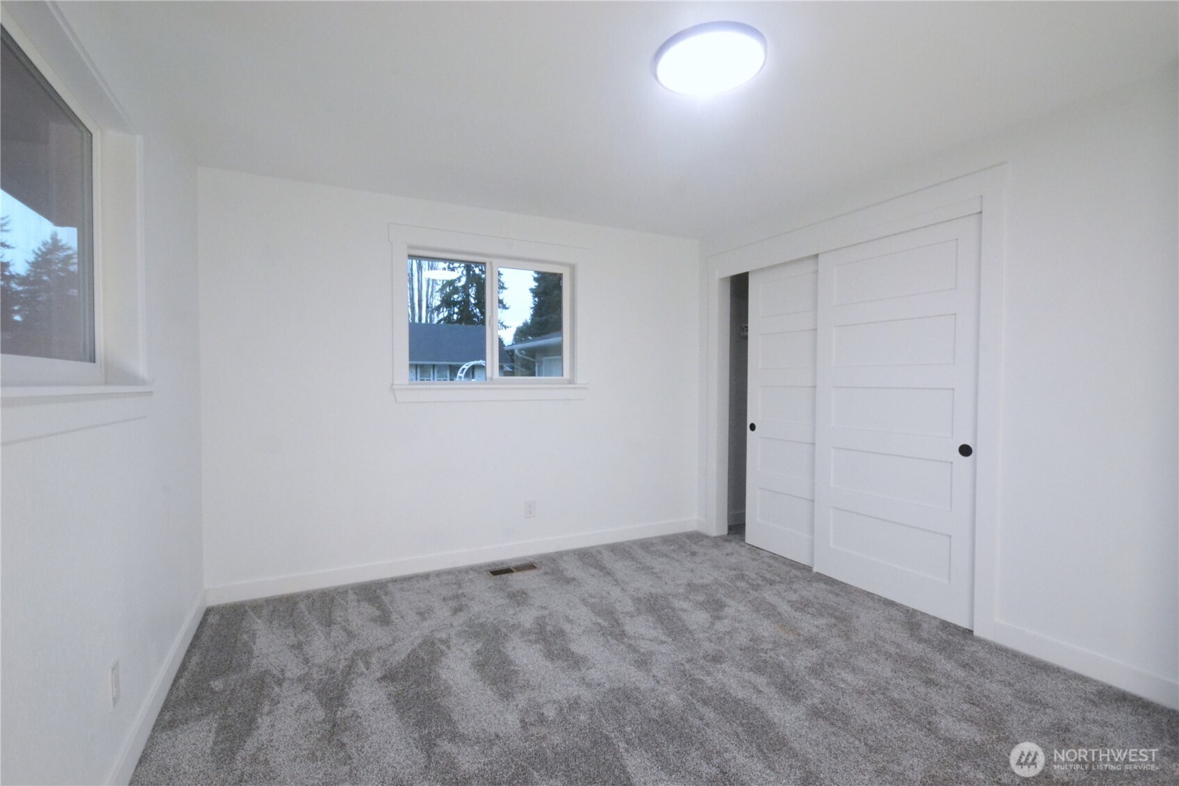 1410 Beech Avenue Steilacoom, WA 98388 - Photo 24 of 38 an empty room with windows and closet