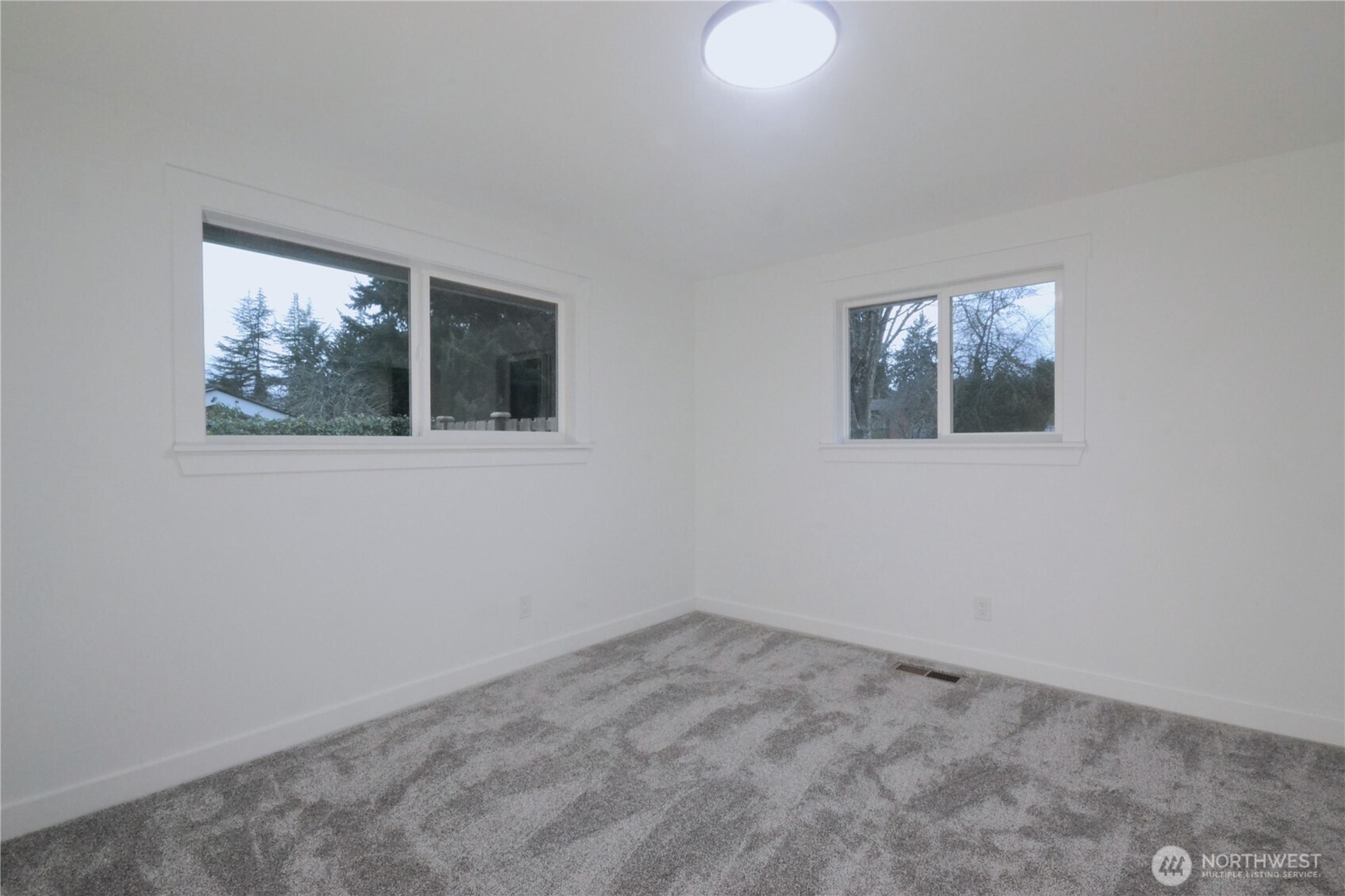 1410 Beech Avenue Steilacoom, WA 98388 - Photo 25 of 38 an empty room with windows