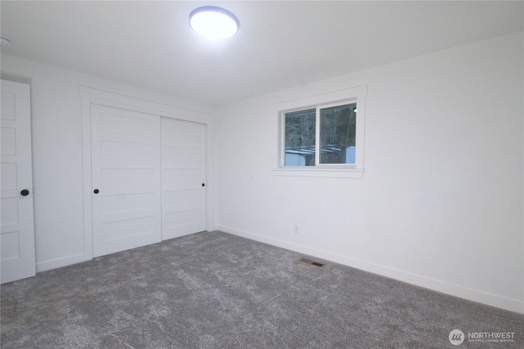 1410 Beech Avenue Steilacoom, WA 98388 - Photo 27 of 38 an empty room with a window
