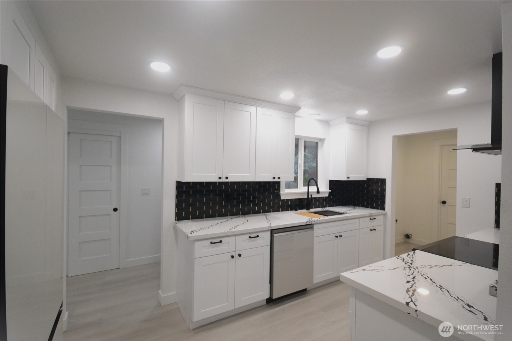 1410 Beech Avenue Steilacoom, WA 98388 - Photo 4 of 38 a kitchen with a sink and cabinets