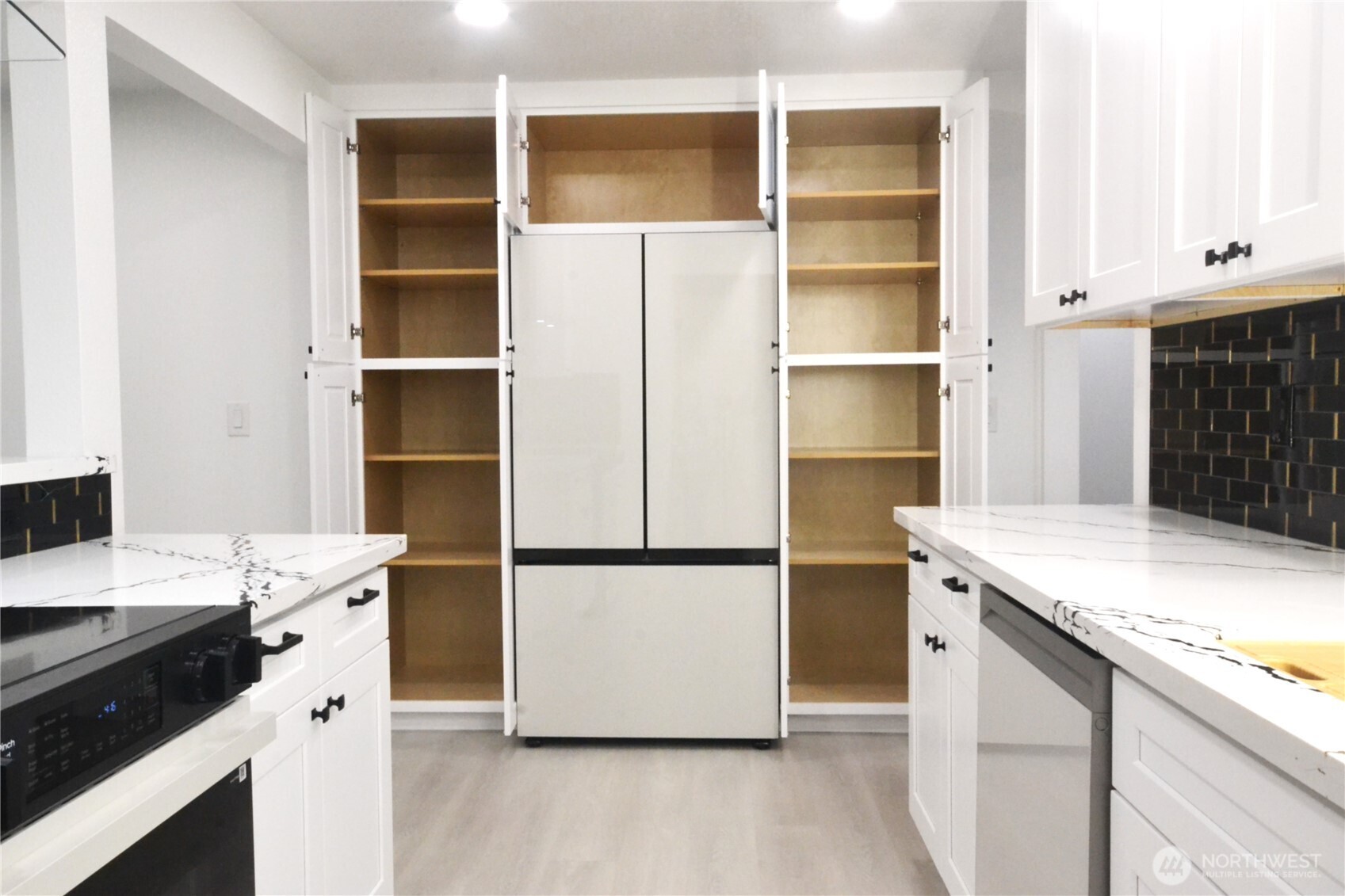 1410 Beech Avenue Steilacoom, WA 98388 - Photo 7 of 38 a kitchen with a refrigerator and a sink