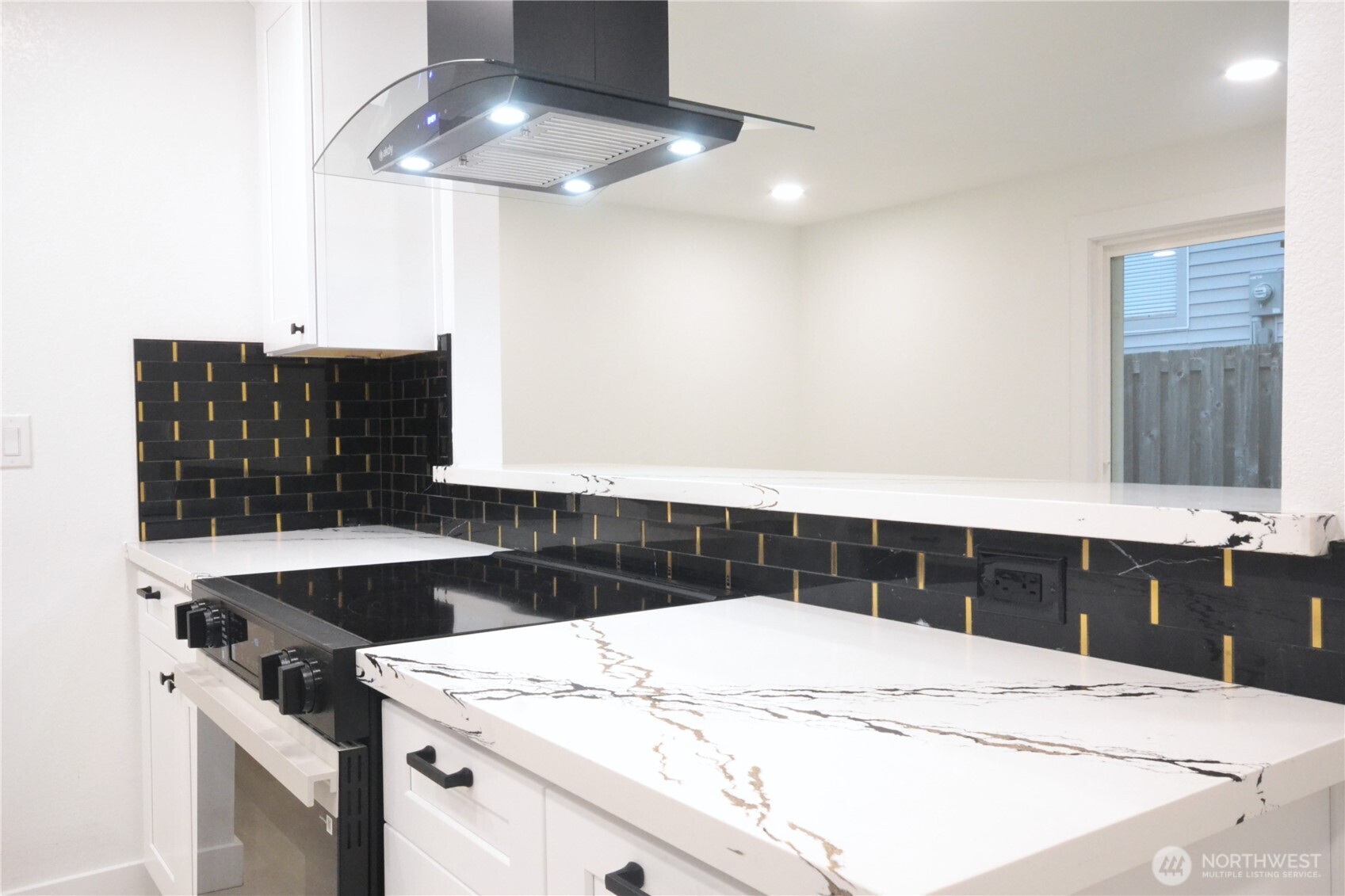 1410 Beech Avenue Steilacoom, WA 98388 - Photo 9 of 38 a kitchen with a sink and a stove