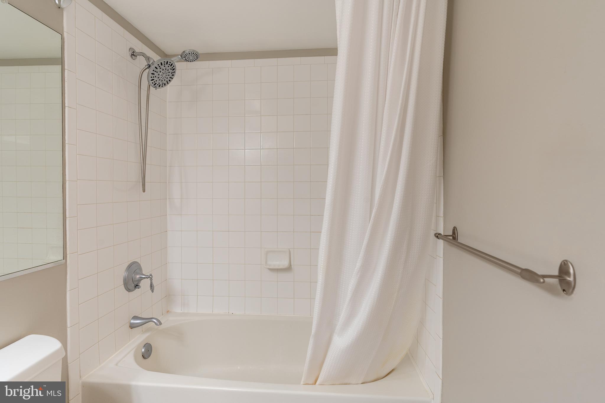 1225 13th Street Northwest, Unit 509 Washington, DC 20005 - Photo 24 of 29 a bathroom with a bathtub