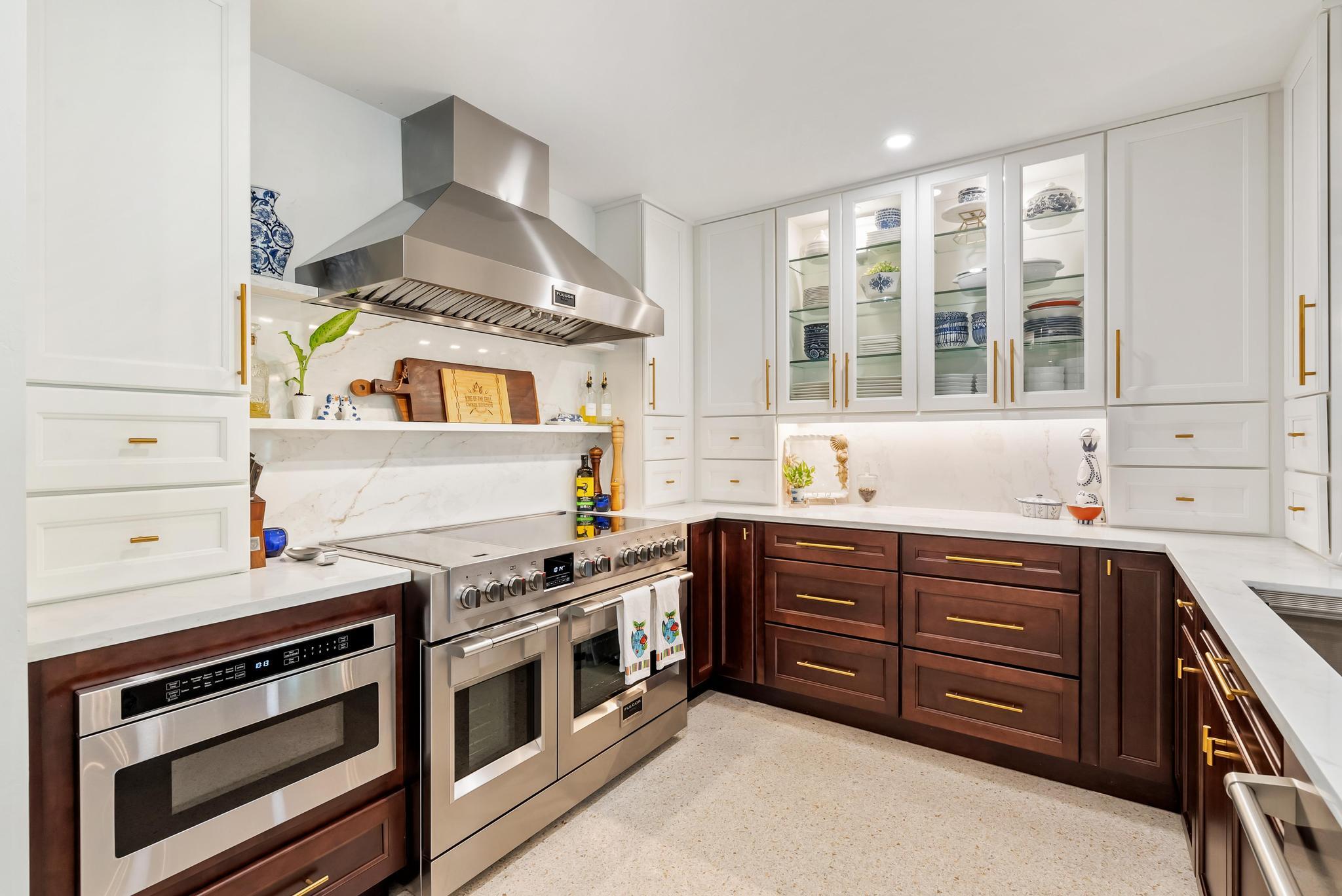 2122 Northridge Road Delray Beach, FL 33444 - Photo 13 of 39 a kitchen with stainless steel appliances a stove and a sink