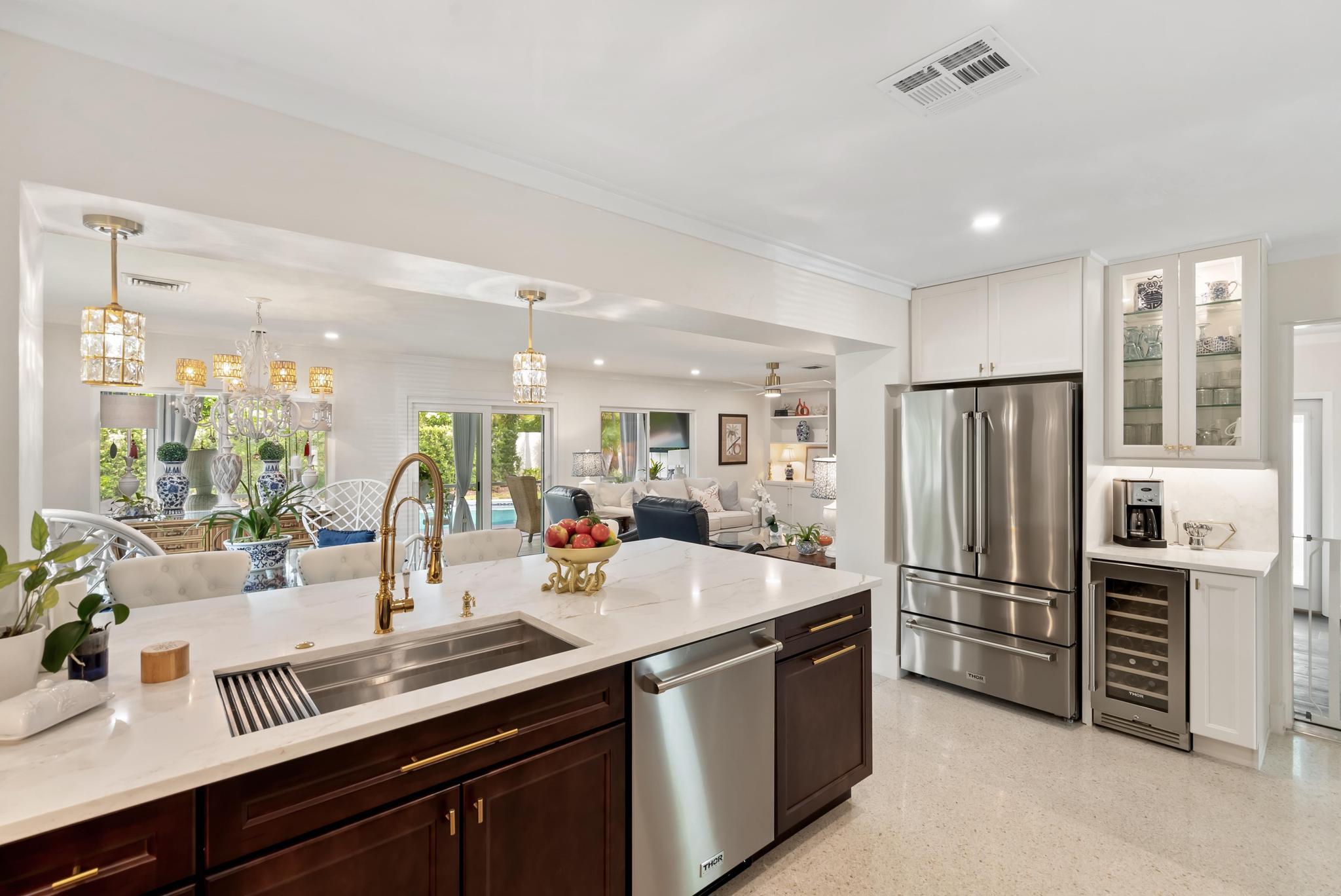 2122 Northridge Road Delray Beach, FL 33444 - Photo 14 of 39 a kitchen with stainless steel appliances a sink and a refrigerator
