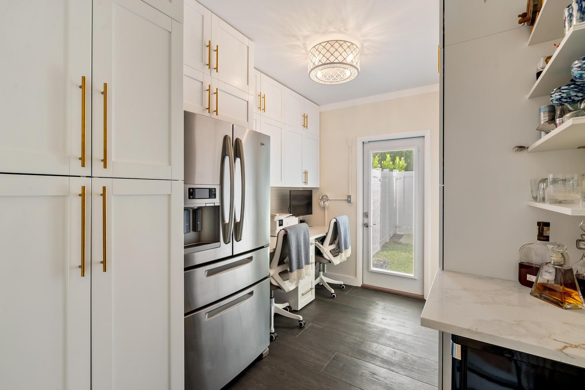 2122 Northridge Road Delray Beach, FL 33444 - Photo 26 of 39 a kitchen with stainless steel appliances a refrigerator and a stove top oven