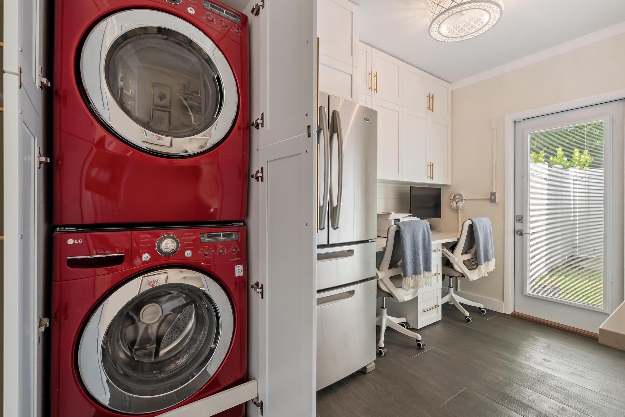 2122 Northridge Road Delray Beach, FL 33444 - Photo 27 of 39 a view of a storage and utility room with washer and dryer