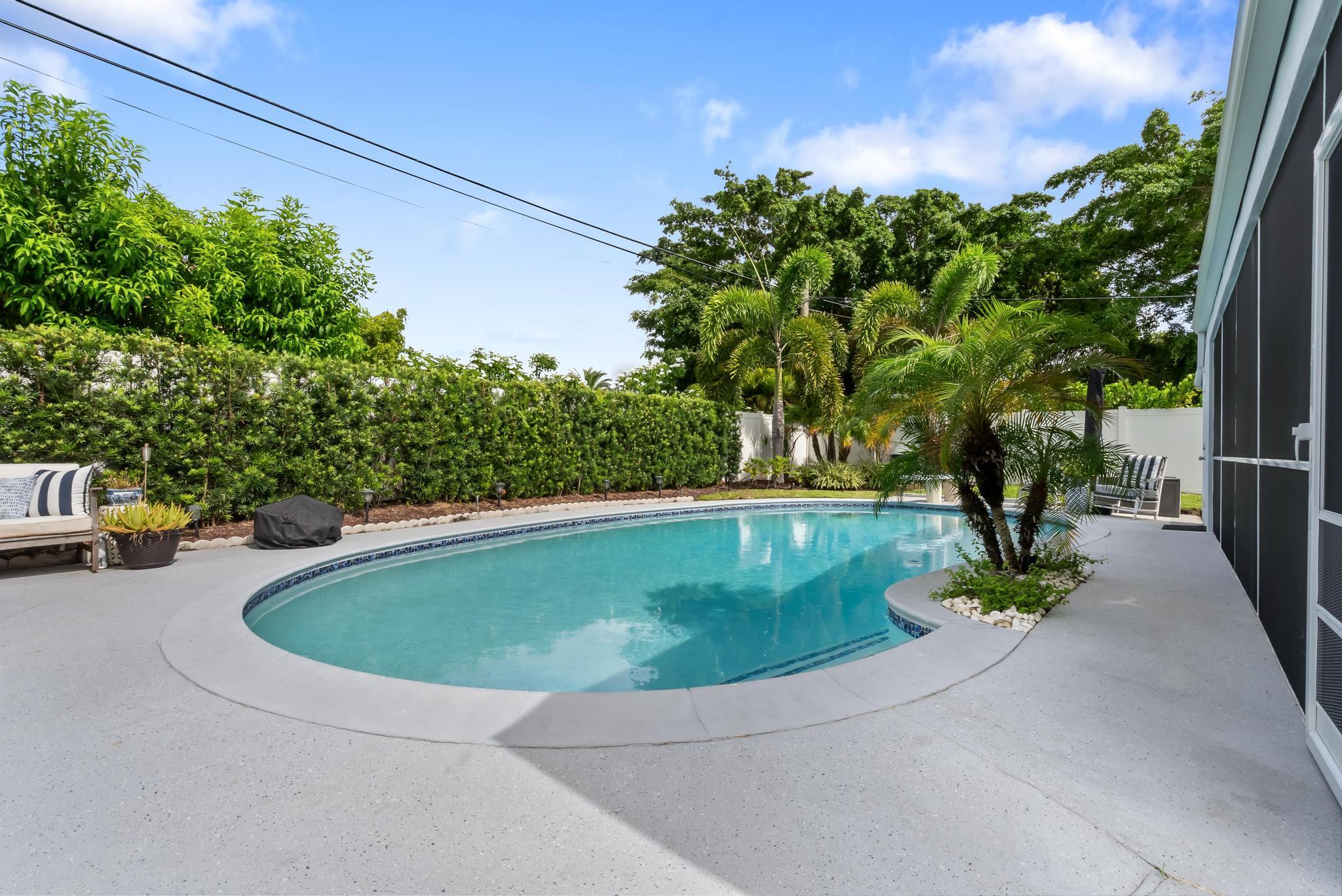 2122 Northridge Road Delray Beach, FL 33444 - Photo 36 of 39 a view of swimming pool with a yard
