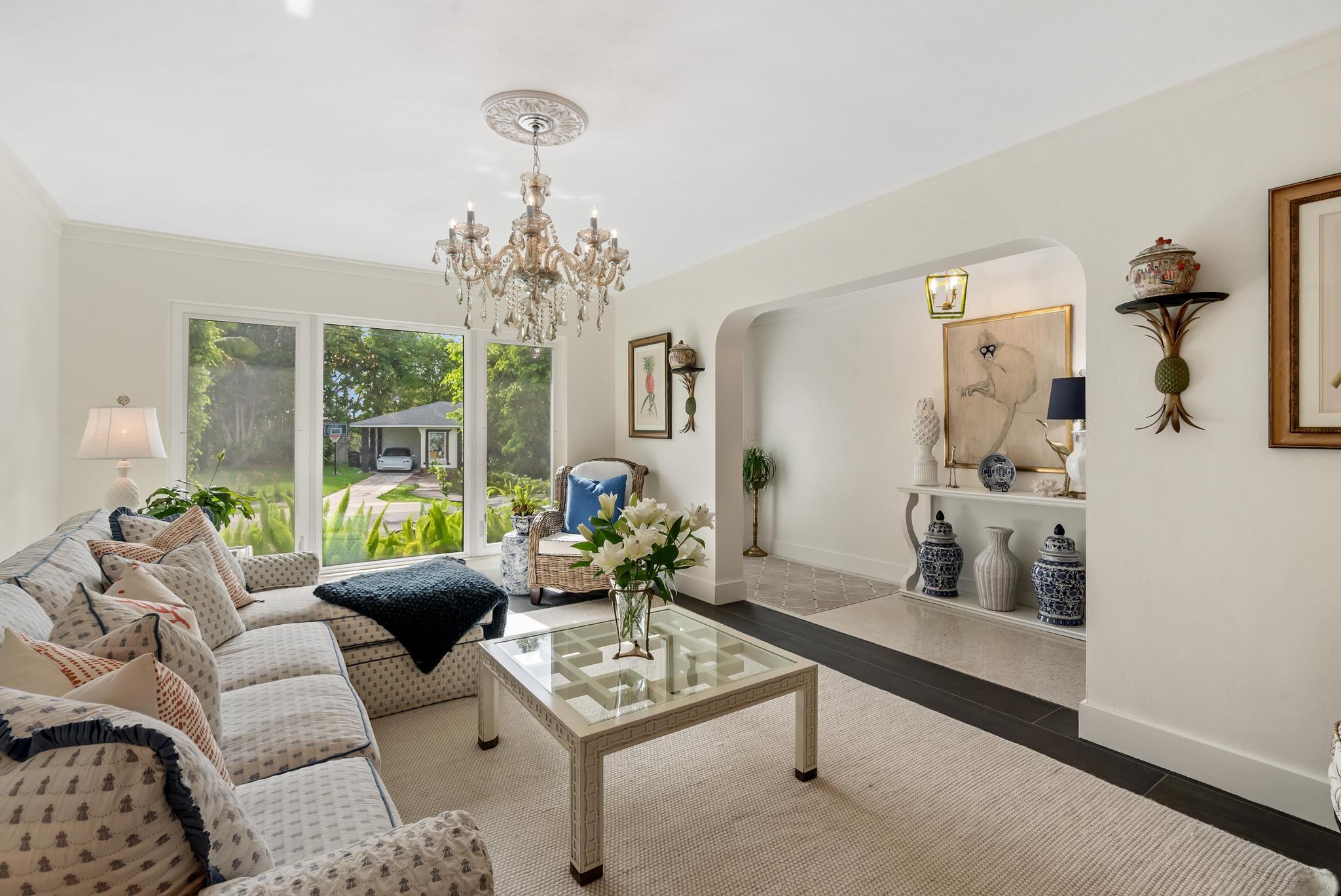 2122 Northridge Road Delray Beach, FL 33444 - Photo 8 of 39 a living room with furniture and a chandelier