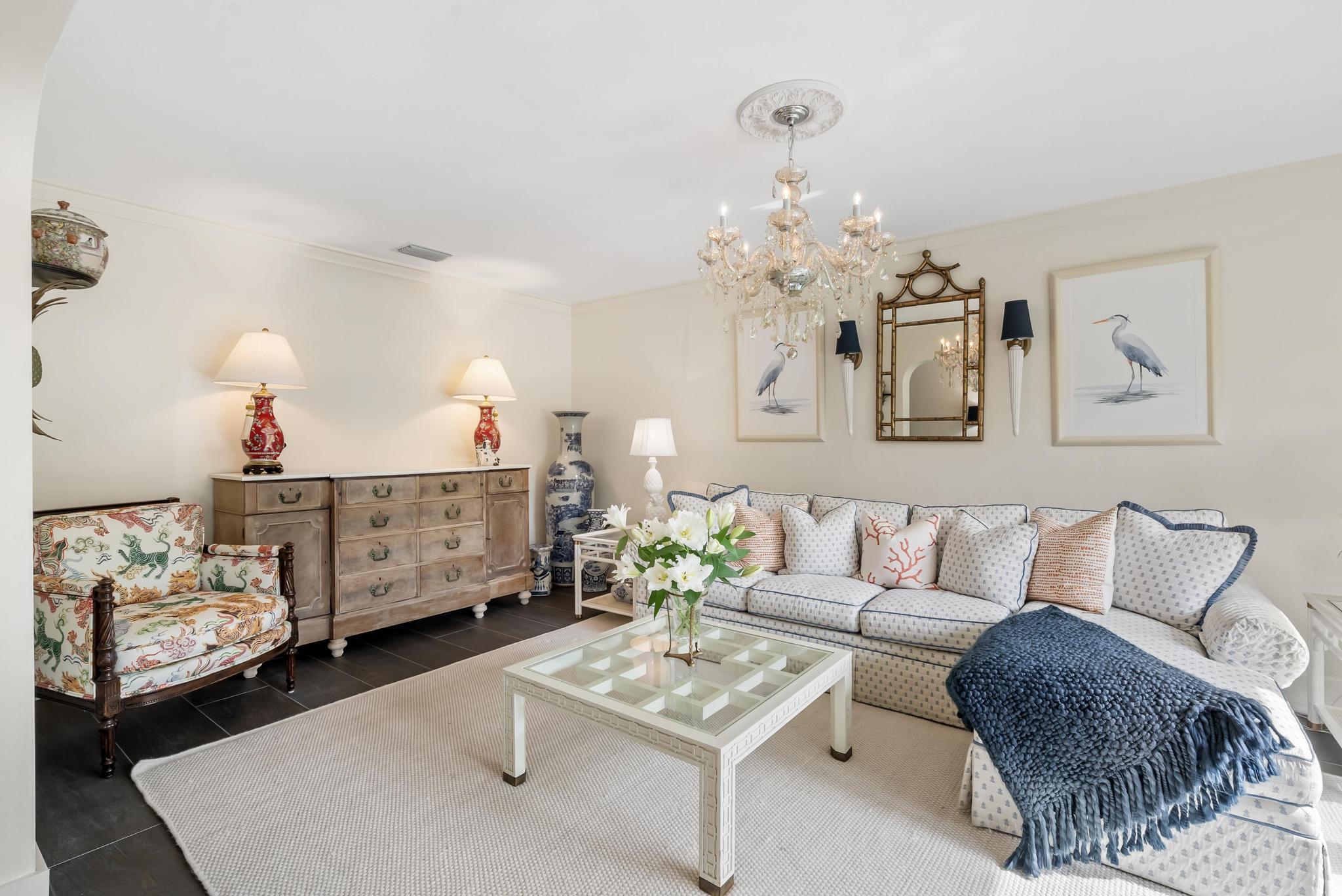 2122 Northridge Road Delray Beach, FL 33444 - Photo 9 of 39 a living room with furniture and a chandelier