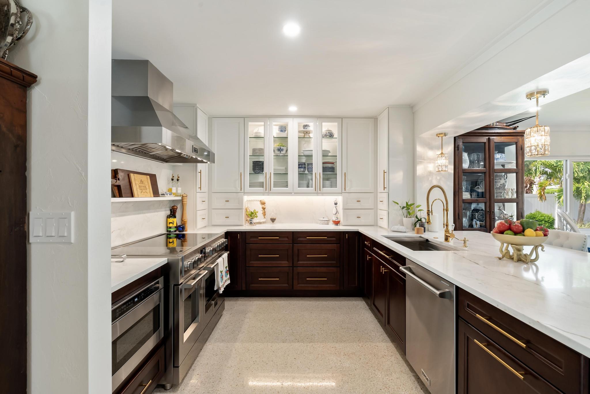 2122 Northridge Road Delray Beach, FL 33444 - Photo 10 of 39 a large kitchen with stainless steel appliances granite countertop a sink stove and cabinets