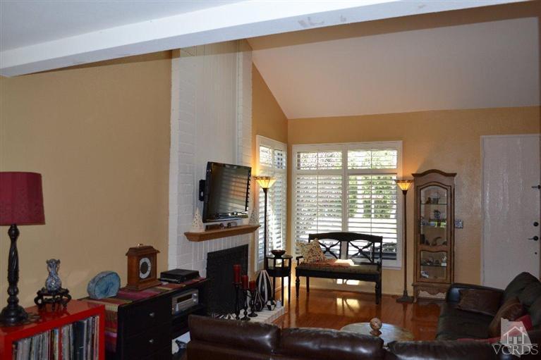 974 Hillview Circle Simi Valley, CA 93065 - Photo 12 of 33 a living room with fireplace furniture and a flat screen tv