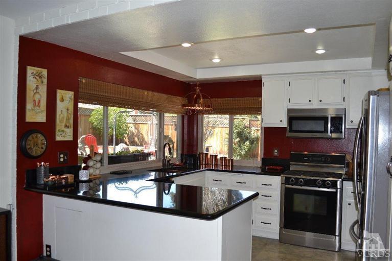 974 Hillview Circle Simi Valley, CA 93065 - Photo 18 of 33 a kitchen with stainless steel appliances granite countertop a sink a stove and a refrigerator