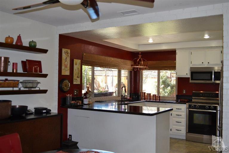 974 Hillview Circle Simi Valley, CA 93065 - Photo 19 of 33 a kitchen with granite countertop a stove and a refrigerator