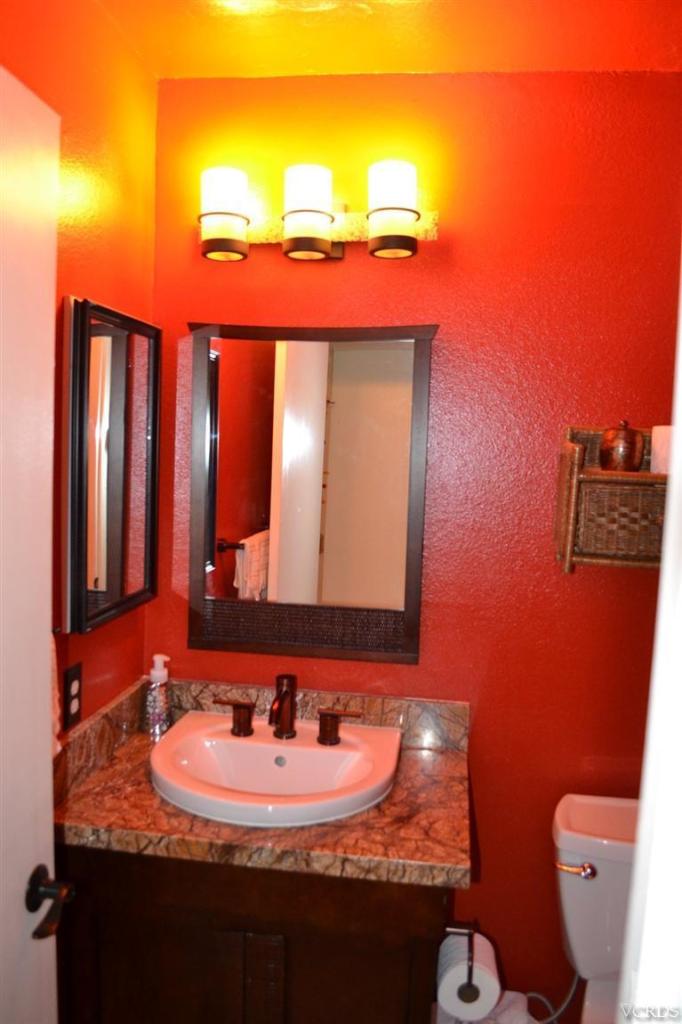974 Hillview Circle Simi Valley, CA 93065 - Photo 20 of 33 a bathroom with a granite countertop sink and a toilet