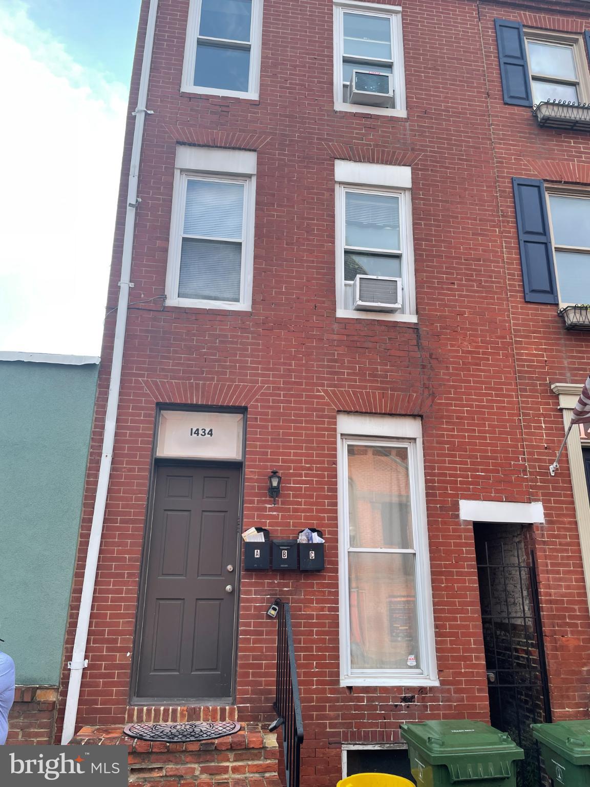 1434 Light Street Baltimore, MD 21230 - Photo 1 of 20 a brick building with a small yard