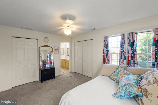 a bedroom with a bed and a table