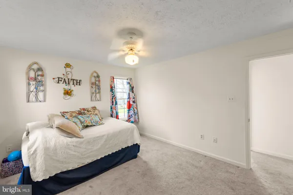 a bathroom with a granite countertop sink mirror and a bathtub