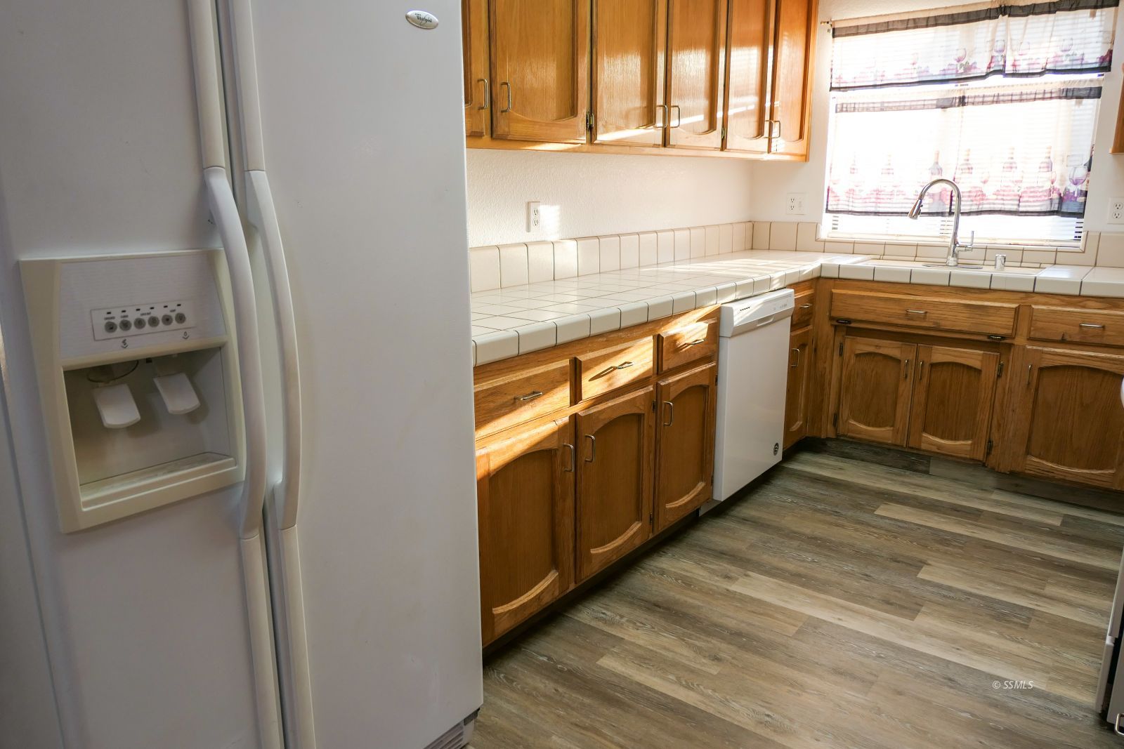 322 Reese Street Ridgecrest, CA 93555 - Photo 14 of 35 a kitchen with stainless steel appliances granite countertop a sink and a stove next to a window