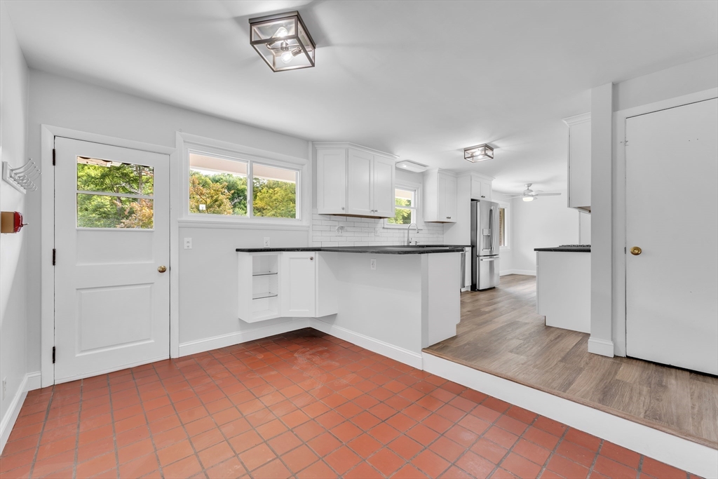 1127 East Street North Suffield, CT 06078 - Photo 14 of 40 a kitchen with stainless steel appliances a refrigerator and a stove top oven
