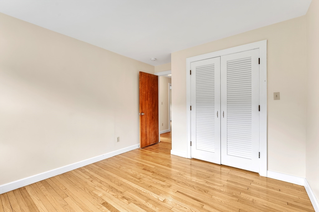 1127 East Street North Suffield, CT 06078 - Photo 20 of 40 a view of an empty room with wooden floor