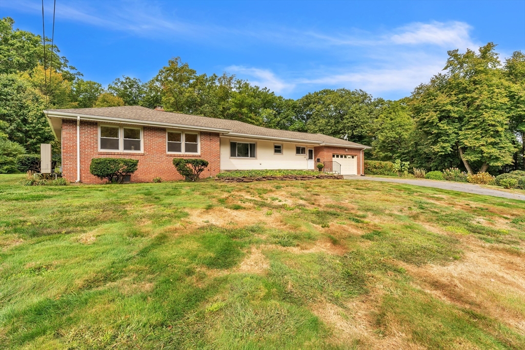 1127 East Street North Suffield, CT 06078 - Photo 2 of 40 a house view with a garden space