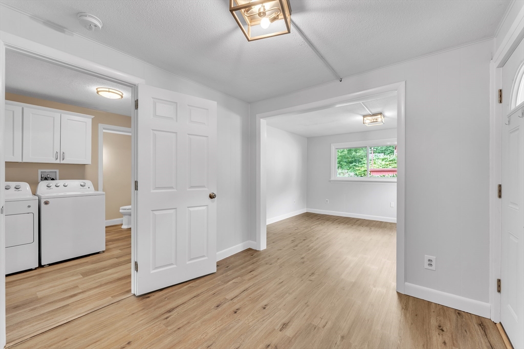 1127 East Street North Suffield, CT 06078 - Photo 28 of 40 a view of a kitchen with wooden floor and a window