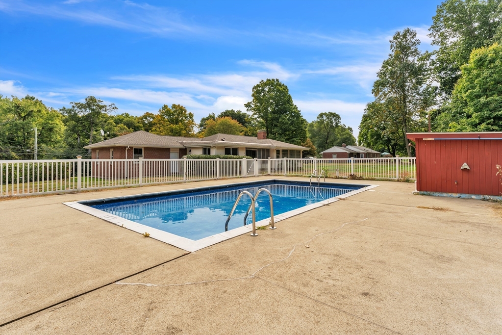 1127 East Street North Suffield, CT 06078 - Photo 38 of 40 a view of a swimming pool with a lounge chair