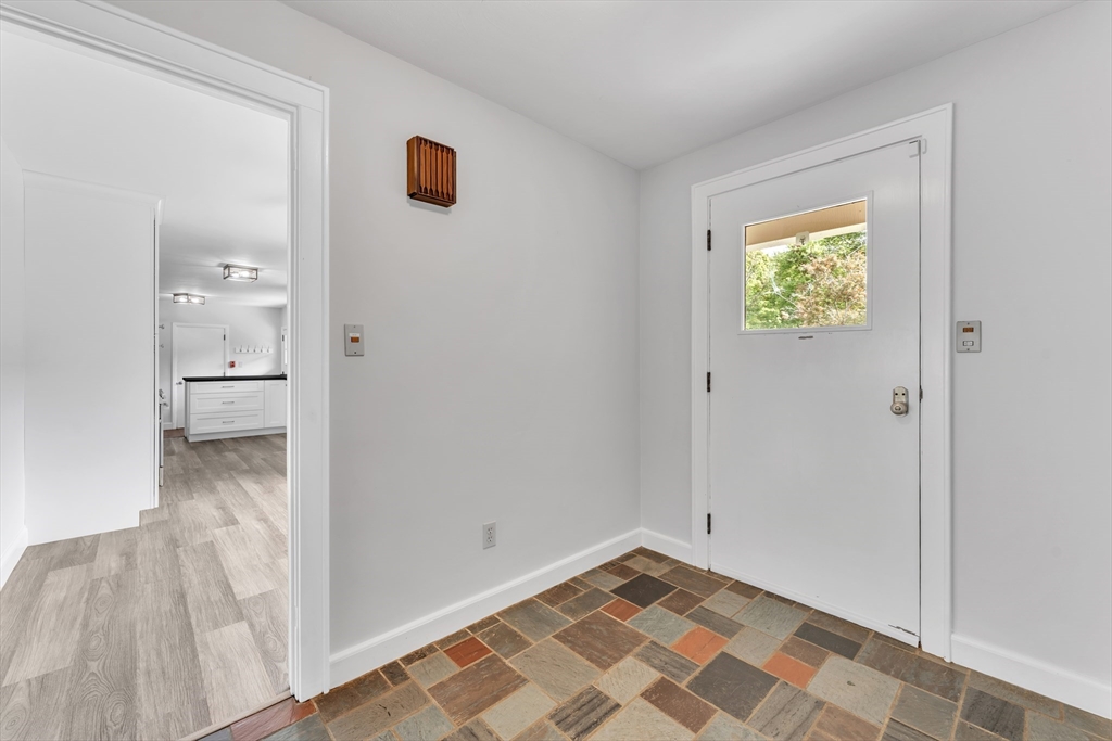 1127 East Street North Suffield, CT 06078 - Photo 5 of 40 a view of a hallway view with wooden floor and a bathroom