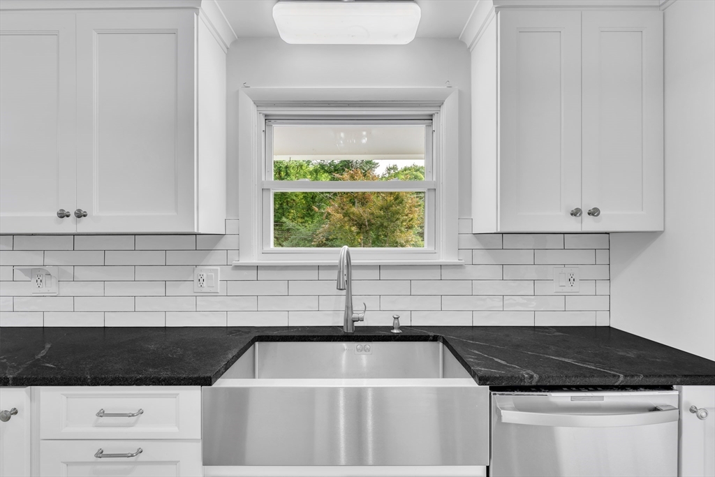 1127 East Street North Suffield, CT 06078 - Photo 9 of 40 a kitchen with granite countertop a sink and a stove
