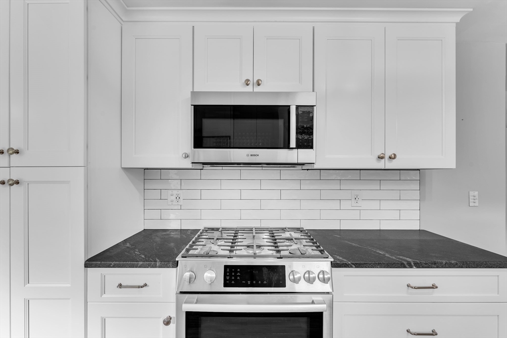 1127 East Street North Suffield, CT 06078 - Photo 10 of 40 a stove top oven sitting inside of a kitchen