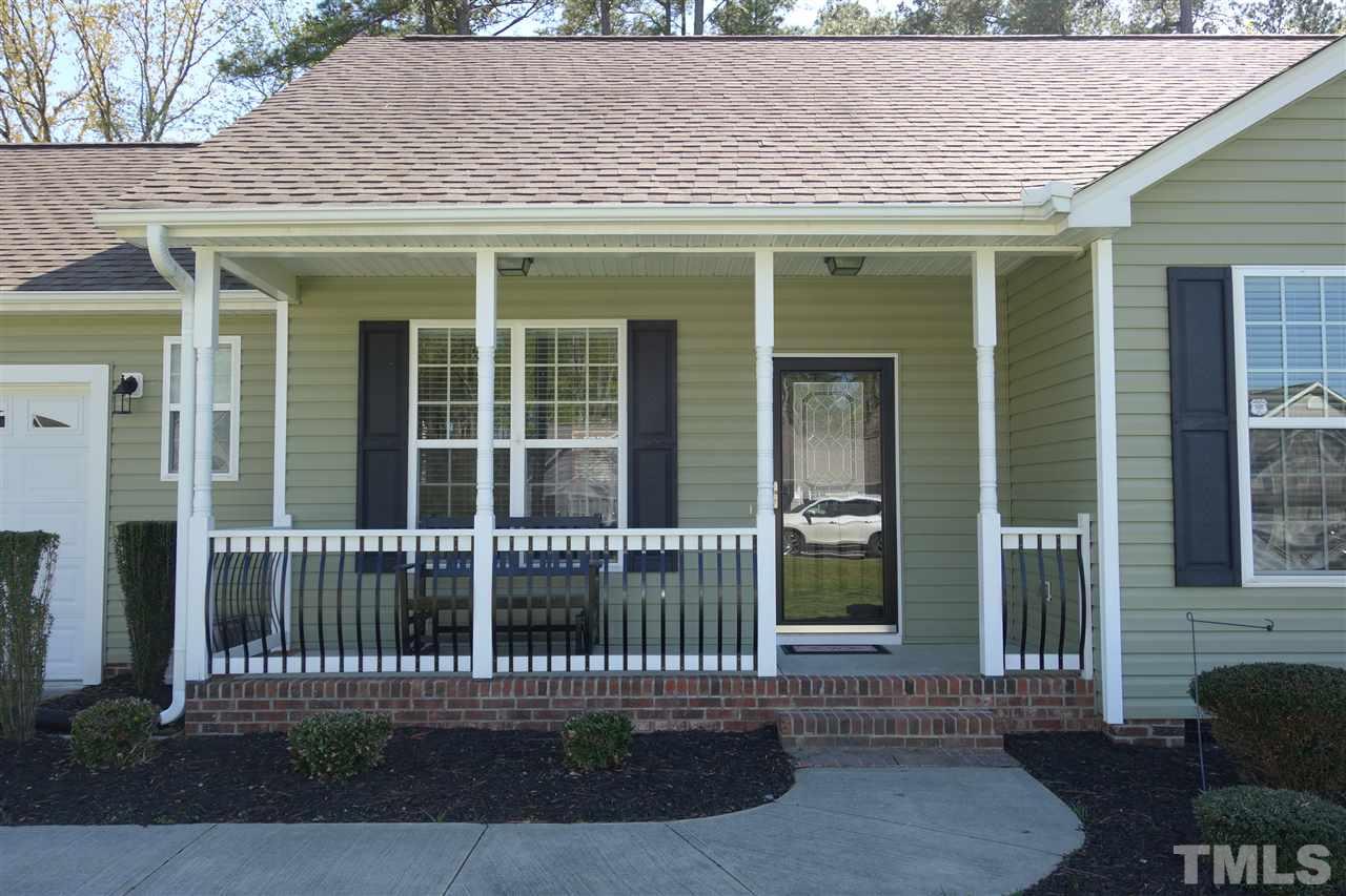63 West Waycliff Road Henderson, NC 27537 - Photo 2 of 24 Rocking chair covered front porch