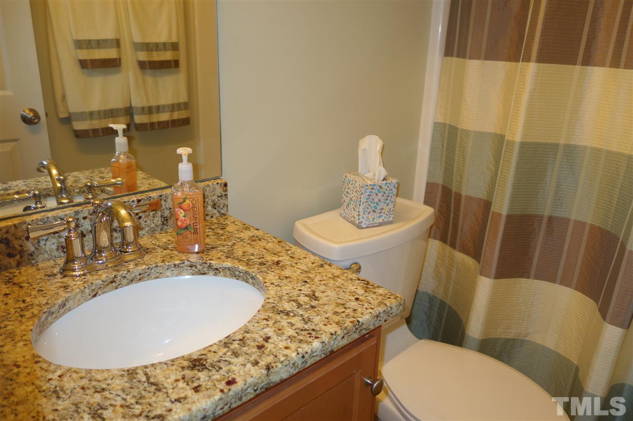 63 West Waycliff Road Henderson, NC 27537 - Photo 17 of 24 The hall bath has a granite counter top